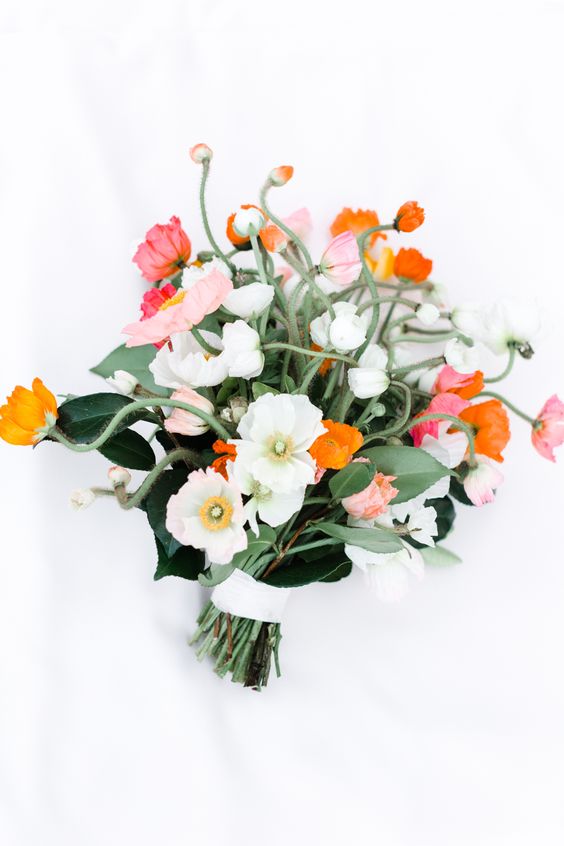 a cool wedding bouquet of white, pink, orange and coral poppies is all you need for a spring or summer wedding