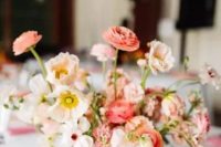 a pretty wedding centerpiece of white and pink poppies, pink ranunculus is a beautiful idea for spring or summer