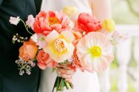a simple and cool wedding bouquet of light pink and yellow poppies, peonies and orange roses for a modern and colorful wedding