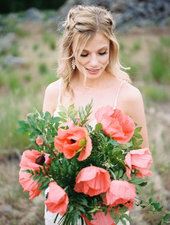 a super bold red poppy wedding bouquet with some greenery is a simple, catchy and lovely idea for a spring or summer bride
