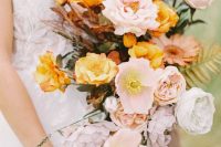 an amber wedding bouquet of amber and light pink poppies and some other blooms, twigs and grasses is a great solution for the fall