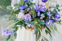 03 a beautiful wedding bouquet with purple, pink and light pink blooms and greenery and with cascading elements is amazing