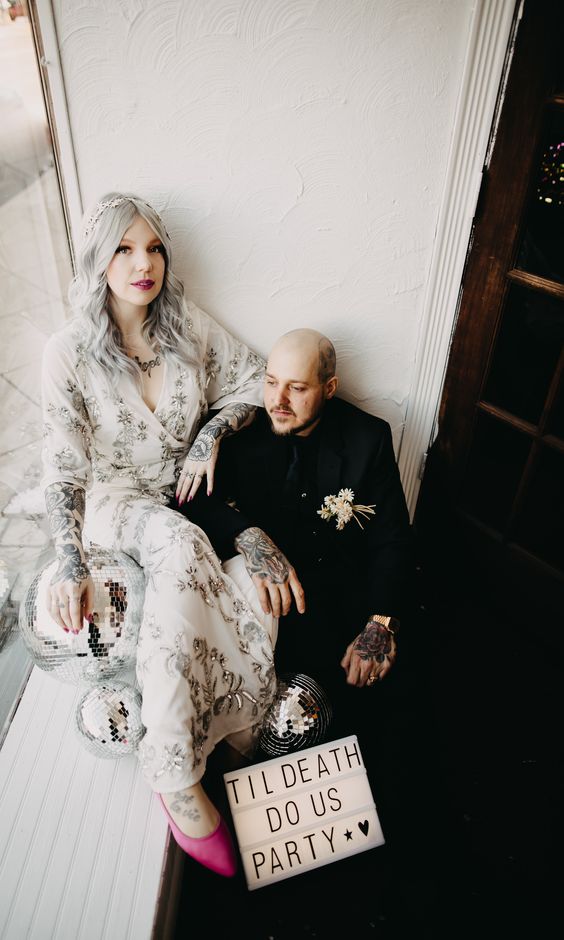 a breathtaking rock n roll bridal look with a neutral embellished wrap maxi dress, pink shoes, a celestail headpiece and all the tattoos shown off