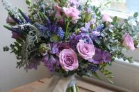 04 a beautiful wedding bouquet with purple, violet, pink blooms, astilbe, greenery and succulents is a lovely idea for a summer bride