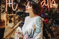 04 a gorgeous romantic rock n roll bridal look with a silk slip wedding dress, bold tattoos shown off and a statement colorful crown and bouquet