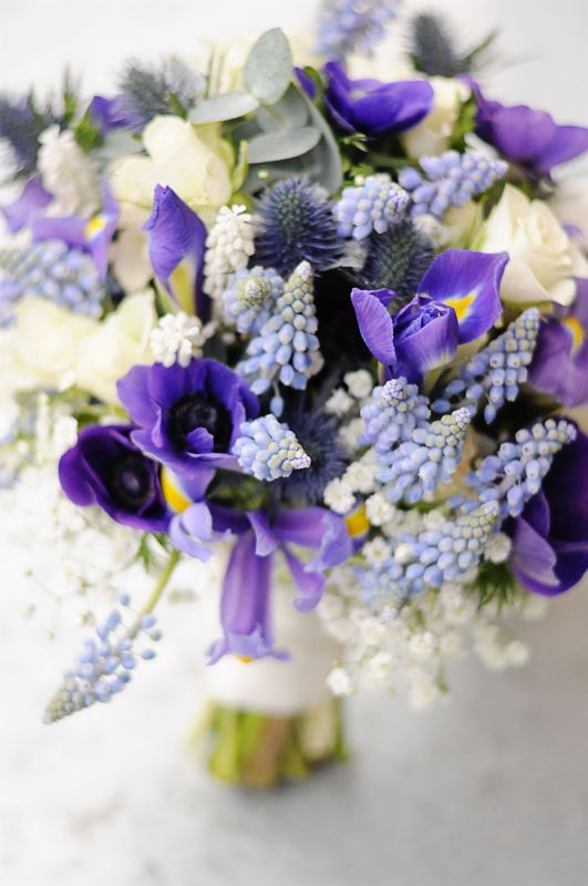 a bold and catchy purple wedding bouquet with purple, lilac and white spring blooms pkus eucalyptus and thistles is amazing