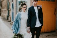 10 a rock bridal look with a refined and girlish embellished lace wedding dress, black leather boots, an oversized blue denim jacket, a black lip and a catchy hairstyle