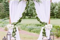 a lovely cozy wedding arch