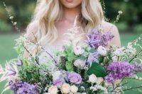 12 a chic and lush lilac wedding bouquet with neutral and blush blooms, blooming branches and greenery is a lovely idea for spring