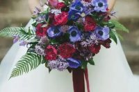 14 a fantastic and bold fall wedding bouquet with purple anemones, burgundy roses and lilac blooms, greenery and foliage