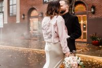 15 a delicate and romantic rock n roll bridal look with a neutral slip wedding dress with a train and fringe, a pink painted denim jacket and black leather boots