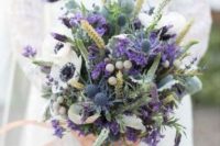 16 a fantastic textural wedding bouquet with wihte and bold purple blooms, berries, greenery, astilbe and thistles is wow