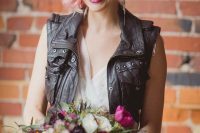 18 a lovely rock n roll bridal look with a romantic embellished wedding dres,s a black leather waistcoat, pink hair, piercings and a hot pink lip