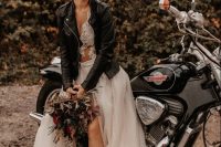 21 a rock n roll bridal look with a delicate lace top, a printed maxi skirt, black chunky boots, a black leather jacket and a cool rock hairstyle