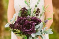 23 a plum-colored wedding bouquet with greenery and grasses is a bold and catchy idea for a fall bride