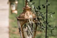 24 gorgeous wedding aisle decor with a beautiful vintage copper candle lantern topped with greenery is amazing