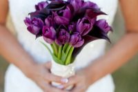 25 a purple tulip and deep purple calla wedding bouquet with a wrap and buttons is a lovely and bold idea for a summer wedding