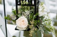 25 wedding aisle decor with a vintage lantern with neutral blooms and greenery is a lovely idea for a rustic wedding
