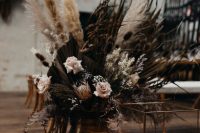 26 wedding ceremony space decor with dried blooms and grasses, sleek and minimalist candle lanterns is chic and stylish