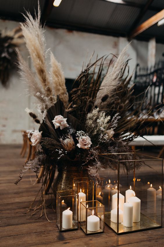 wedding ceremony space decor with dried blooms and grasses, sleek and minimalist candle lanterns is chic and stylish
