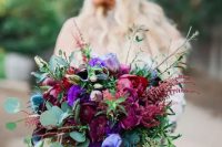 28 a statement jewel tone wedding bouquet with deep purple, burgundy, violet blooms, thistles and greenery for a bold wedding