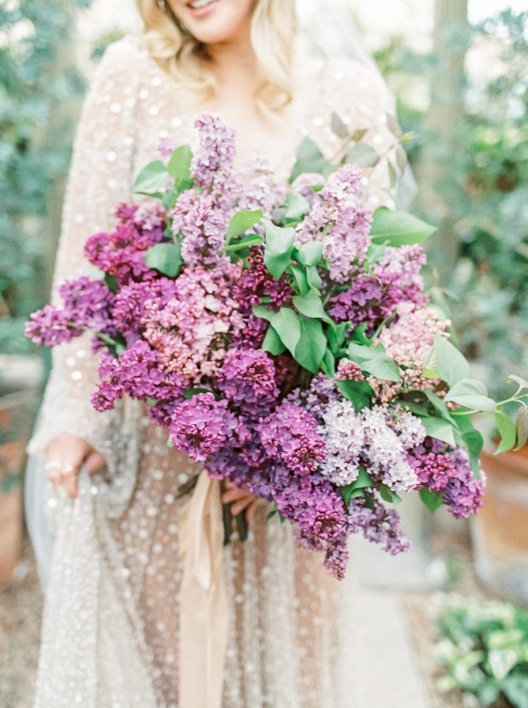 a classic lilac wedding bouquet with greenery is a gorgeous idea for a spring bride, add some leaves for a catchy look