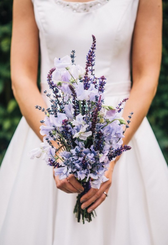 a modest yet catchy wedding bouquet with lilac blooms and lavender is a cool idea for a summer or summer to fall bride