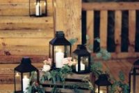 36 lovely rustic wedding decor of crates, black candle lanterns, white blooms is a chic and cozy idea for a rustic wedding