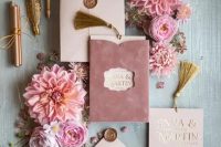 a beautiful and delicate wedding invitation suite with blush and lilac velvet touches, gold stencils and gold printing for a spring or summer wedding