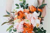 a bold and chic wedding bouquet with orange and blush blooms, greenery and berries is a fantastic idea for the fall