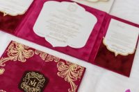 a bright fuchsia and hot pink wedding invitation suite with gold patterns, gold calligraphy and ribbon is amazing