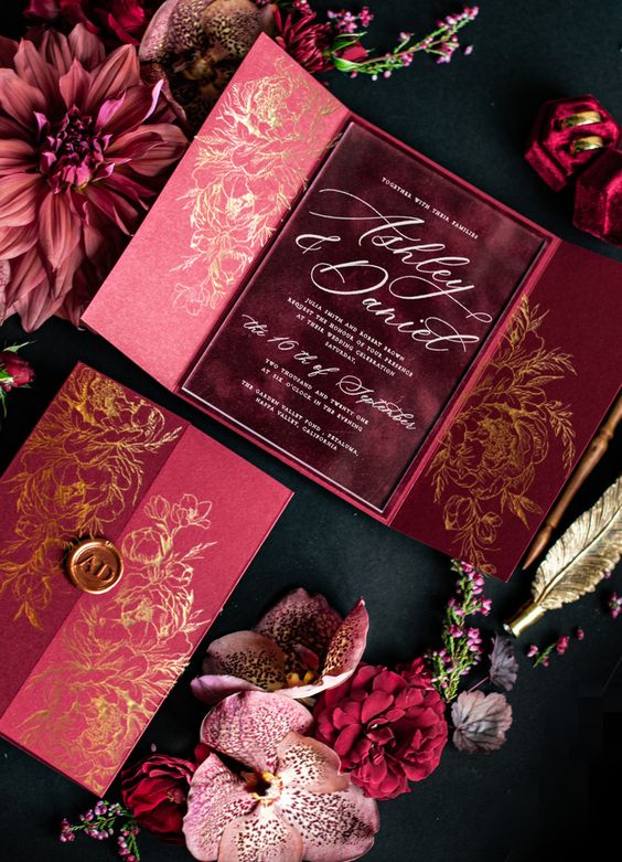 a chic fuchsia and burgundy wedding invitation suite with gold calligraphy and gold patterns is a lovely idea for a fall wedding