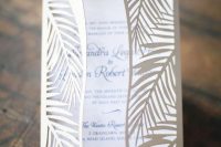a cool and lovely tropical leaf laser cut wedding invitation with black calligraphy is a lovely idea for a tropical wedding