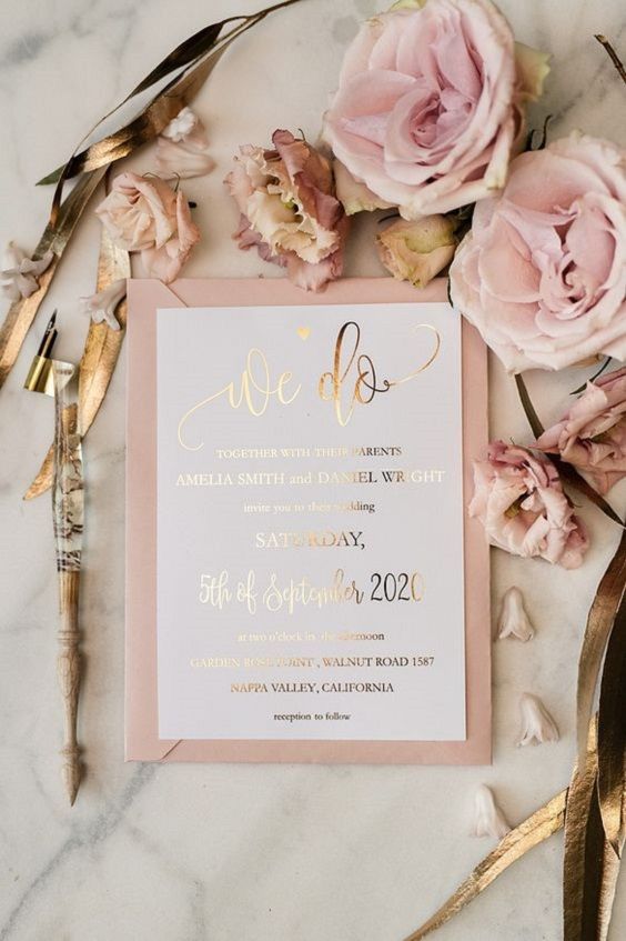 a cute and sweet white wedding invitation with gold foil calligraphy and a pink envelope is a lovely idea for a pink wedding