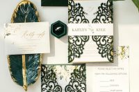 a fantastic wedding invitation suite with a green velvet envelope, laser cut invite covers and gold lettering and calligraphy