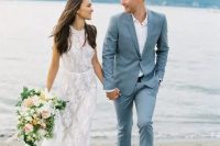 a grey blue suit, a white shirt and brown shoes for a modern seaside wedding
