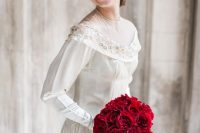a jaw-dropping red rose cascading wedding bouquet is a fresh take on classics – you rock red roses but in a modern way