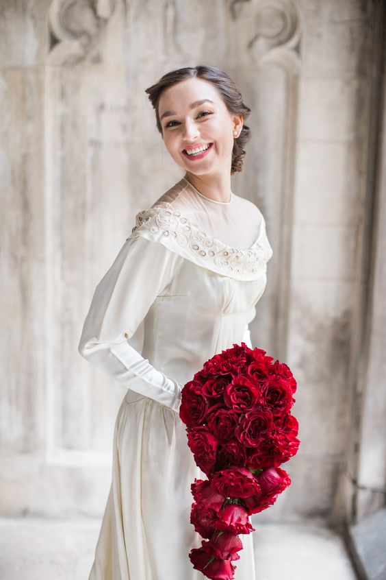 a jaw dropping red rose cascading wedding bouquet is a fresh take on classics   you rock red roses but in a modern way
