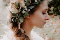 a lush and pretty textural floral crown with foliage, berries and feathers is a great idea for a boho bride