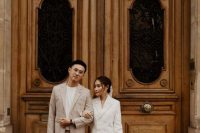 a minimalist groom’s look with a tan pantsuit, a white t-shirt and white sneakers is a lovely idea for a neutral wedding