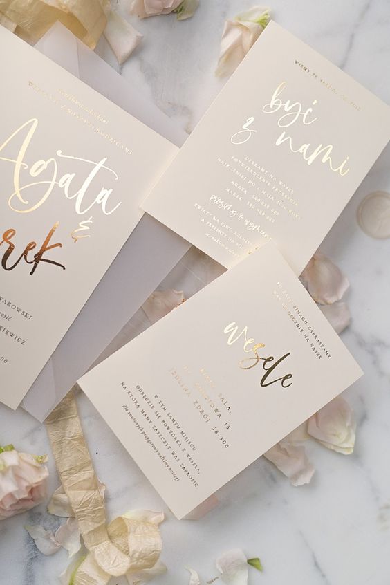 a neutral and cool wedding invitation suite with gold foil calligraphy is a lovely and chic idea for a modern and stylish wedding