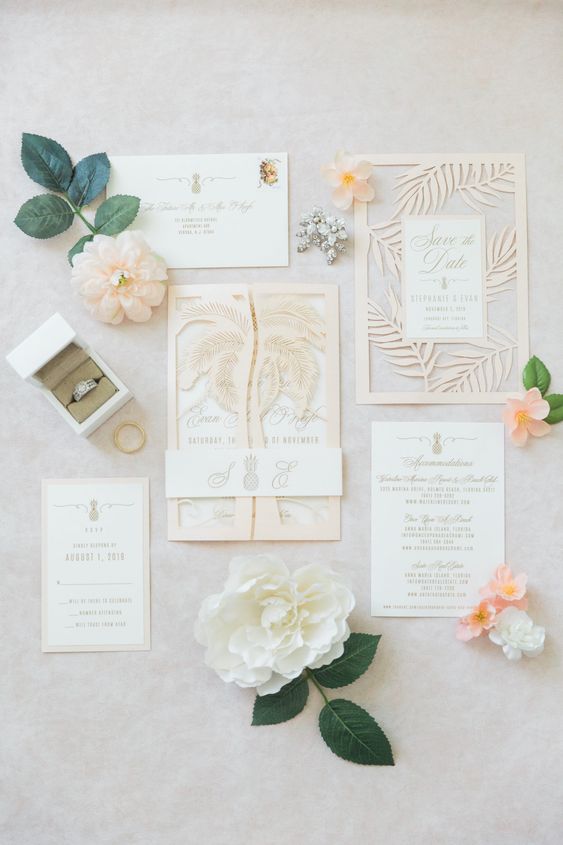 a neutral tropical wedding invitation suite with a leaf laser cut save the date and a palm tree jacket, neutral invites with calligraphy