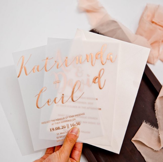a neutral wedding invitation suite with gold foil calligraphy and a vellum foiled piece is a lovely idea for a modern wedding