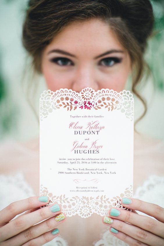 a pretty and chic neutral laser cut wedding invitation with pink and copper blooms printed and some colorful calligraphy is wow