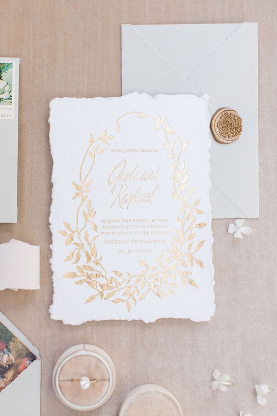 a refined and chic raw edge wedding invitation with gold foil letters and leaves is a lovely idea for a sophisticated wedding