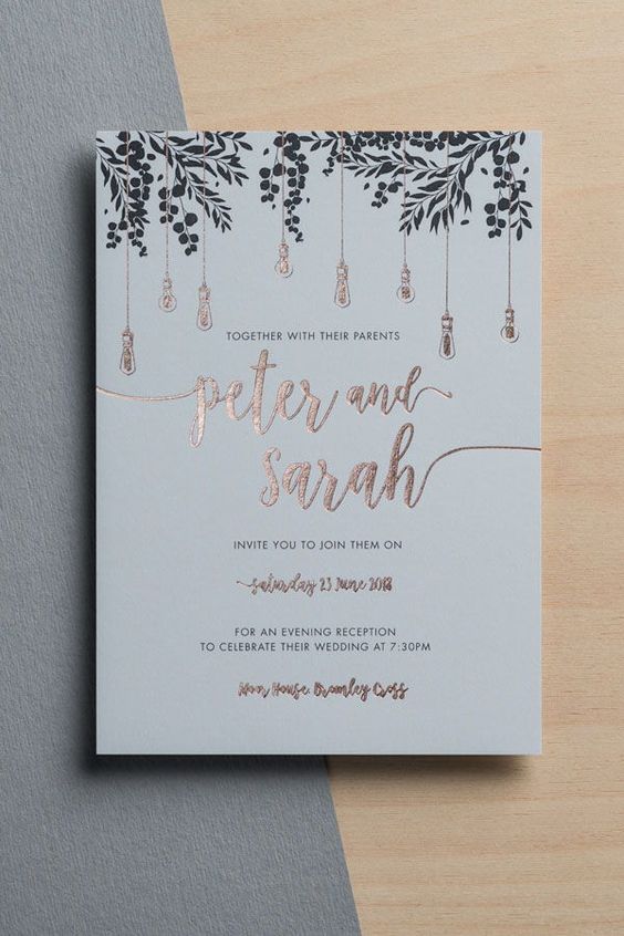 a stylish wedding invitation in grey, with black prints and copper foil calligraphy is a cool idea for a modern wedding