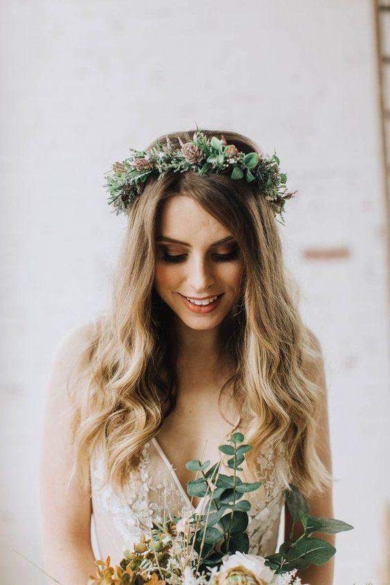 a winter bridal crown done with foliage, pinecones and much texture is a lovely idea for a boho bride