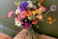 05 a bright wedding bouquet with dahlias, chamomiles, billy balls and many other blooms including allium is great for summer