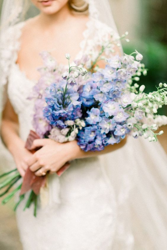 a lilac, blue and white delphinium wedding bouquet will be a chic and bold accent for a wedding with such colors