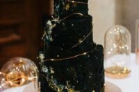 18 a black textural wedding cake showing off space and decorated with LEDs to mark stars is a fantastic idea